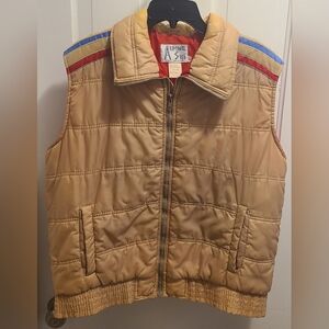 Alpine Ski Tan Puffer Vest with Red and Blue Accents On Sholder